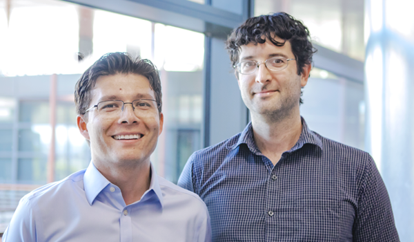 Image of Dr. Sergiu Pasca and Dr. Hunter Fraser standing together inside the Clark Center.