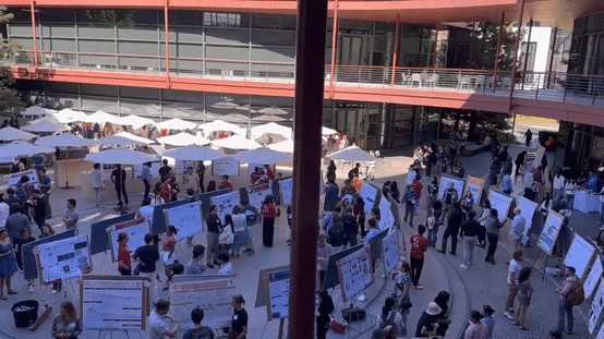 Gif panning over Clark Courtyard, showing hundreds of researchers presenting posters.