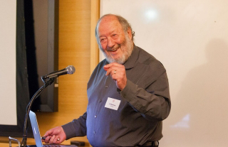 Photo of Dr. Weissman speaking.