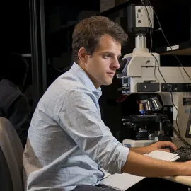 Student looking intent in a lab setting.