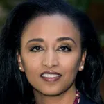 Photo of smiling female faculty member with long black hair, Dr. Aida Habtezion, Professor of Medicine at Stanford University.