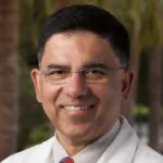 Photo of smiling male faculty member, Dr. Aijaz Ahmed, Professor of Medicine at Stanford University.