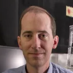 Photo of smiling white male faculty member, Dr. Alex Dunn, Professor of Chemical Engineering at Stanford University.