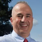 Headshot portrait of Alex Macario -  Professor of Anesthesiology, Perioperative and Pain Medicine and (by courtesy) of Health Research and Policy