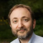 Headshot portrait of Andrew Fire -  George D. Smith Professor in Molecular and Genetic Medicine and Professor of Pathology and of Genetics