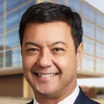 Headshot photo of a smiling male faculty member, Dr. Antonio Omuro, Professor of Neurology at Stanford University.