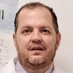 Indoor headshot photo of a white male faculty member, Dr. Charles Gawad, Associate Professor of Pediatrics at Stanford University.