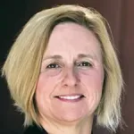 Photo of a smiling white female faculty member with chin-length blonde hair, Dr. Crystal Mackall, Professor of Pediatrics and Medicine at Stanford University.