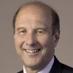 Indoor headshot photo of a smiling white male faculty member, Dr. David Spiegel, Professor of Psychiatry & Behavioral Sciences at Stanford University.