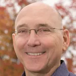 Photo of smiling white male faculty member, Dr. Doug Owens, Professor of Health Policy at Stanford University.
