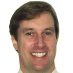 Headshot portrait of Eric Olcott - Professor of Radiology