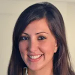 Photo of smiling female faculty member with long brown hair, Dr. Fatima Rodriguez, Assistant Professor of Medicine at Stanford University.