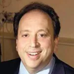 Photo of smiling white male faculty member with short dark hair, Dr. Glenn Chertow, Professor of Medicine at Stanford University.