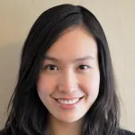 Indoor headshot photo of a smiling Asian female faculty member, Dr. Han Zhu, Assistant Professor of Medicine at Stanford University.