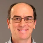 Headshot portrait of John Higgins - Professor of Pathology
