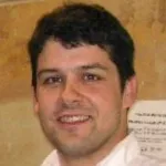Headshot photo of a smiling white male faculty member with short dark hair, Dr. Jonathan Taylor, Professor of Statistics at Stanford University.