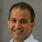Headshot portrait of Sanjay Lall - Associate Professor of Electrical Engineering and of Aeronautics and Astronautics