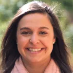 Outdoor headshot photo of a smiling female faculty member, Dr. Irene Llorente, Assistant Professor of Neurosurgery at Stanford University.