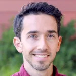 Outdoor headshot photo of a smiling male faculty member, Dr. Matteo Mole, Assistant Professor of Obstetrics & Gynecology at Stanford University.