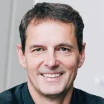Photo of smiling white male faculty member with short dark hair, Dr. Matthew Porteus, Professor of Pediatrics at Stanford University.