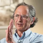 Headshot portrait of Michael Levitt - Robert W. and Vivian K. Cahill Professor in Cancer Research in the School of Medicine and Professor of Structural Biology and (by courtesy) of Computer Science