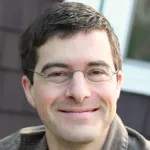 Photo of smiling white male faculty member, Dr. Nathanael Gray, Professor of Chemical & Systems Biology at Stanford University.