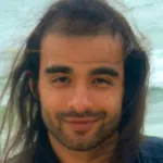 Headshot portrait of Oguzhan Atay - Colella Family Fellow