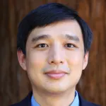 Photo of a smiling Asian male faculty member, Dr. Ruben Luo, Assistant Professor of Pathology at Stanford University.