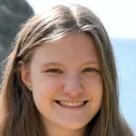 Photo of smiling female undergraduate student Riley Stanford-Hill.