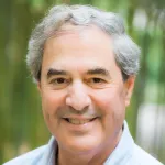 Outdoor headshot photo of a smiling white male faculty member, Dr. Steven Boxer, Professor of Chemistry at Stanford University.