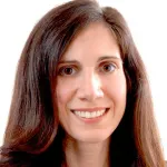Indoor headshot photo of a smiling white female faculty member, Dr. Sylvia Plevritis, Professor of Biomedical Data Science and Radiology at Stanford University.
