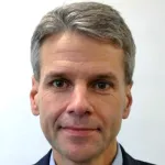 Indoor headshot photo of a white male faculty member, Dr. William Talbot, Professor of Biology at Stanford University.