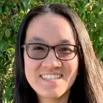Photo of smiling female undergraduate student Caroline Van.
