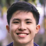Photo of smiling male undergraduate student Kellen Vu.