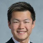 Photo of smiling Asian male faculty member, Dr. Wei Gu, Assistant Professor of Pathology at Stanford University.