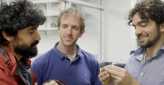 Photo of Dr. Manu Prakash and graduate students Jim Cybulski and Georgios Katsikis.