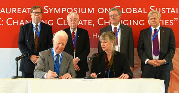 Nobel laureates, from left, standing: George Smoot, Peter Doherty, W.E. Moerner, Brian Schmidt; and seated, James Mirrlees, join memorandum team leader Penny Sackett in Hong Kong on April 25.