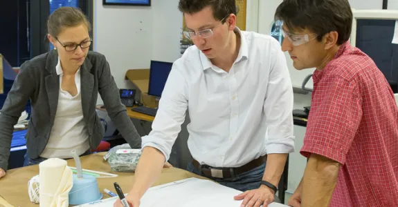Photo of bioengineering postdoc Veronique Peiffer and graduate student Richard Timm working with lecturer Ross Venook.
