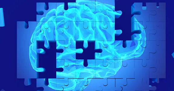 Graphic image of brain made of puzzle pieces.