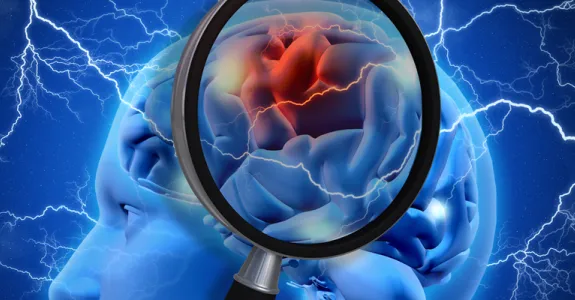 Graphic image of brain under magnifying glass.