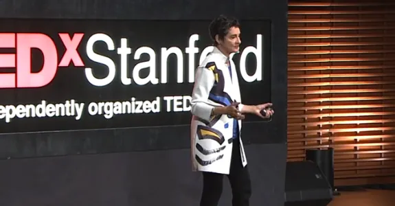 Dr. Carla Shatz delivering the TEDxStanford talk.