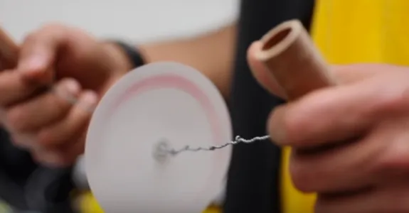Photo of Saad Bhamla using the Paperfuge.