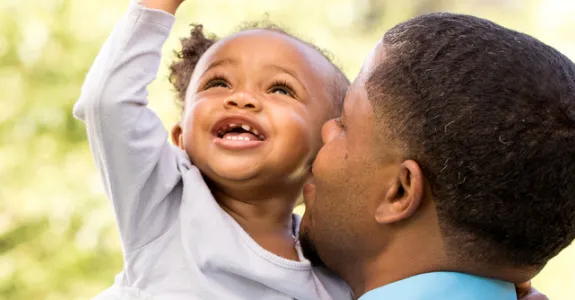 Photo of father and young daughter.
