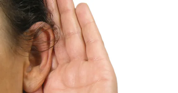 Photo of person experiencing hearing loss.