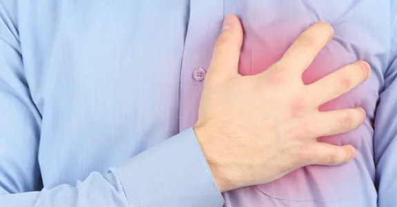 Photo of a man with chest pain.