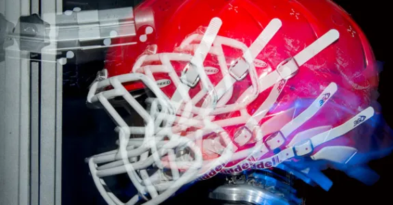 Image of helmet undergoing forces.