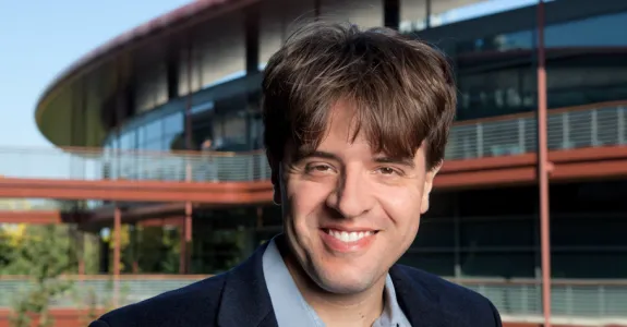 Photo of Dr. Karl Deisseroth standing outside of the Clark Center, home of Stanford Bio-X, at Stanford.