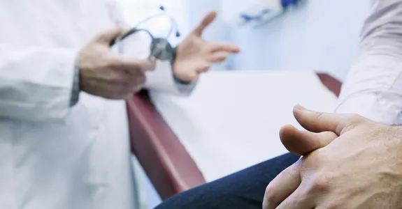Photo of man at doctor.