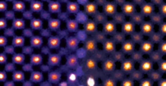 Colorized transmission electron microscopy of ceria ultrathin film, showing atoms as yellow and orange dots against purple.