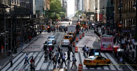 Photo of a busy crosswalk in New York City.